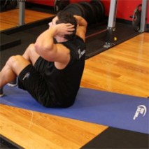 Position 2 - While exhaling out, raise your upper body towards your knees while trying to stay as straight as possible. Do not try to jerk your body to create momentum, your body should be raised solely by the abs